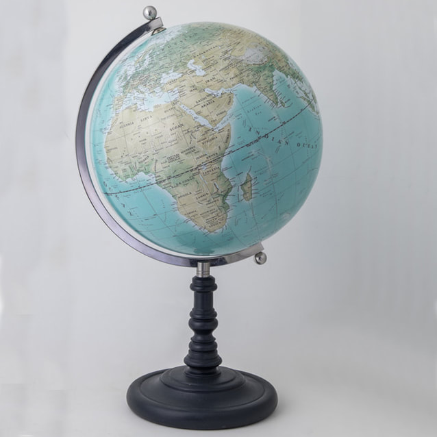 Traditional looking blue globe sitting on a black stand with steel arm