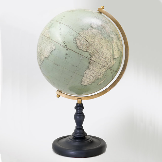 aged brass arm and black turned wooden base with a traditional looking globe with up to date cartography