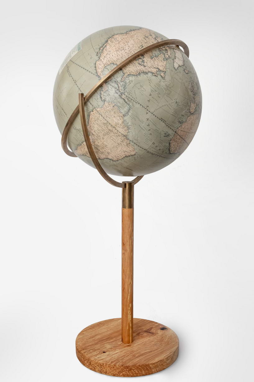 large globe with wooden stand on a brass ring, the globe is made by Lander and May from Cowes