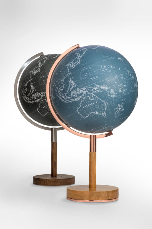 Profile Globe in black or blue with a copper or steel arm, on a slim wood stem. A stylish, contemporary globe.